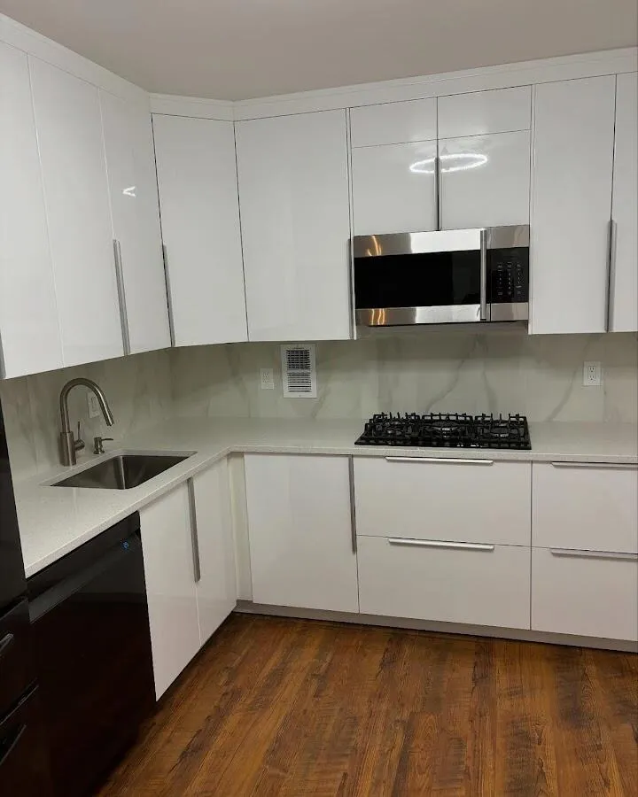 Restored kitchen with white cabinets after water damage in West Park